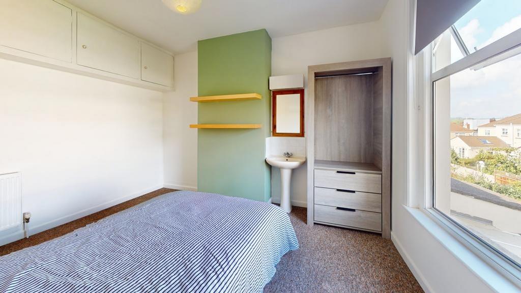 A bright and inviting double bedroom featuring ...