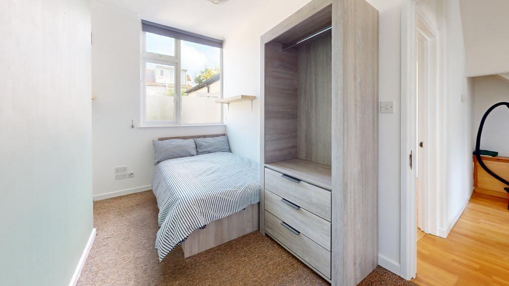 A bright and inviting double bedroom featuring ...