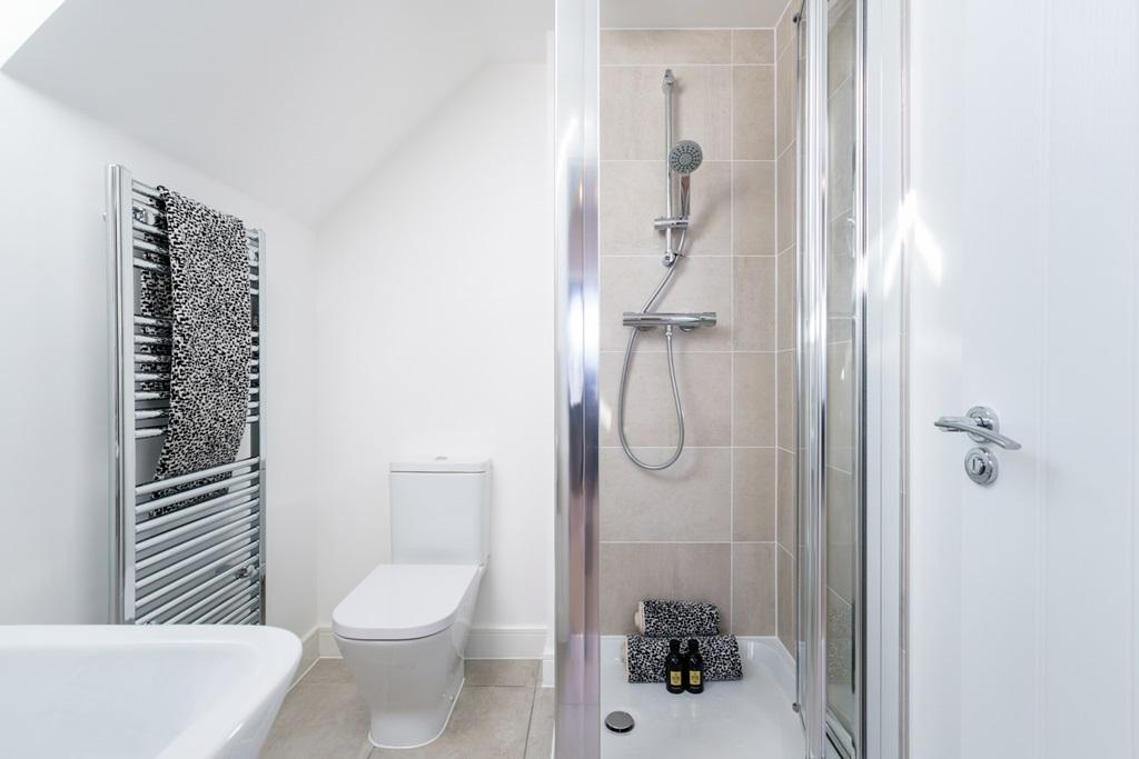 The second floor has its own shower room