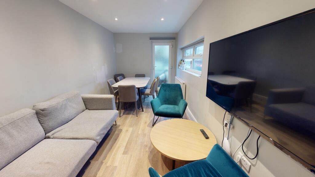 A contemporary living room featuring a cozy sea...