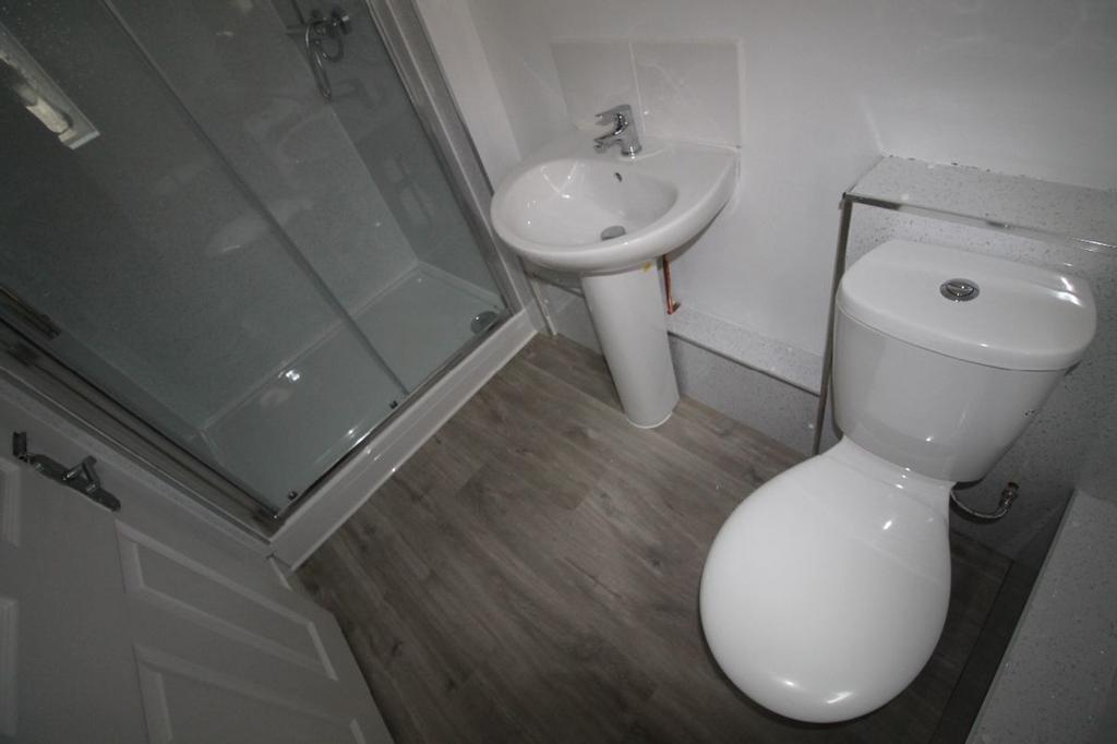 A well-maintained bathroom featuring a modern s...