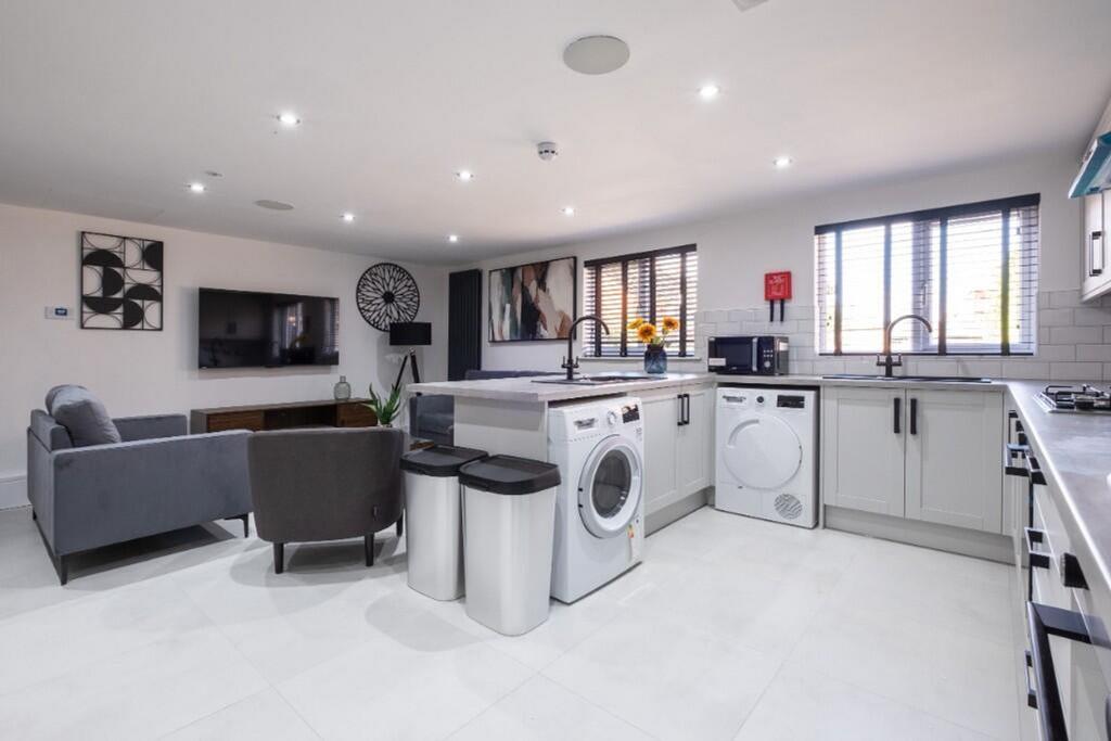 Modern kitchen equipped with essential applianc...