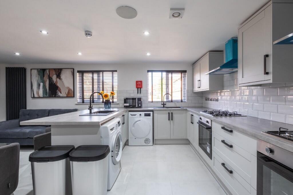 A modern kitchen equipped with sleek appliances...
