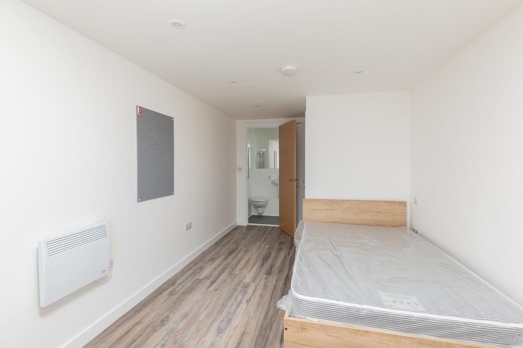 A spacious and bright double bedroom, perfect f...