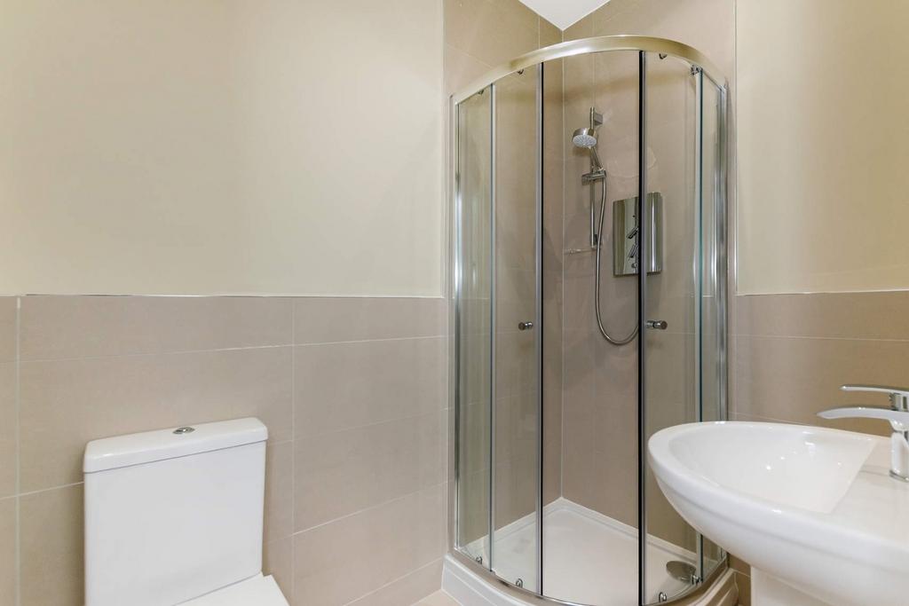Bright and well-maintained bathroom featuring a...