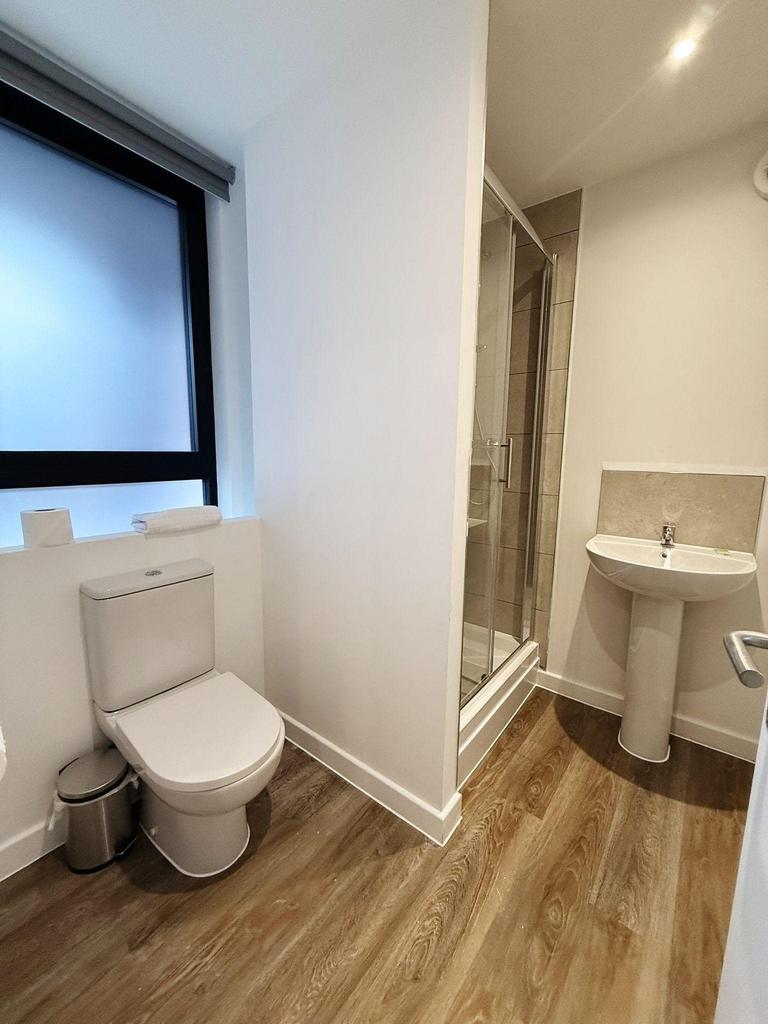 A modern and clean bathroom featuring a spaciou...