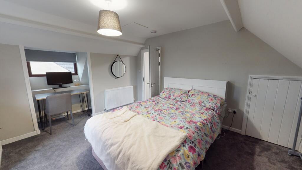 A beautifully decorated double bedroom featurin...