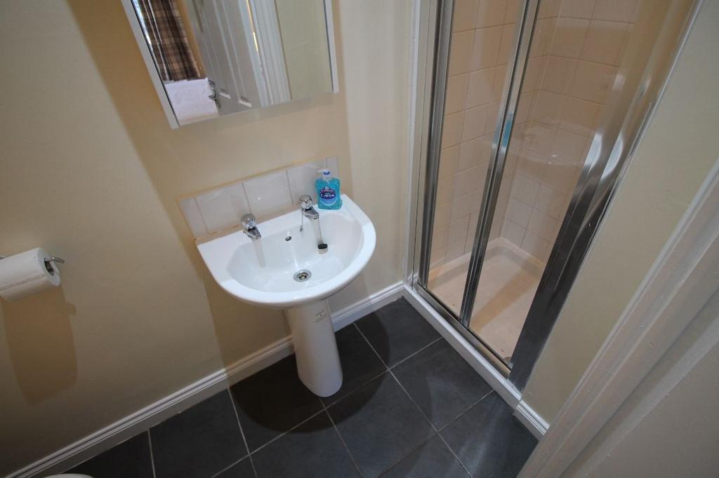 A well-maintained bathroom featuring a modern s...