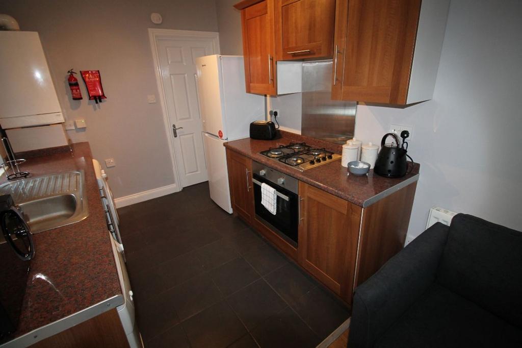 This modern kitchen features ample cabinet spac...