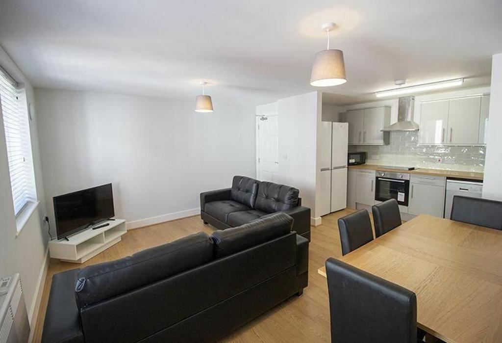 A modern and inviting living room featuring com...