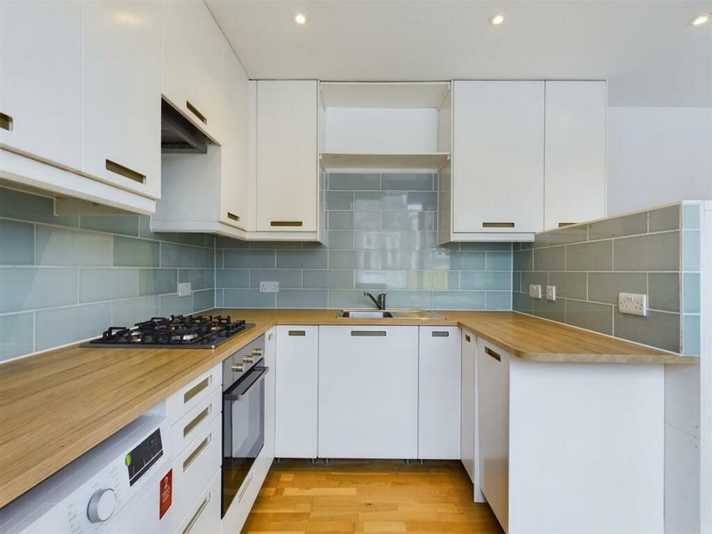 A modern and well-equipped kitchenette featurin...