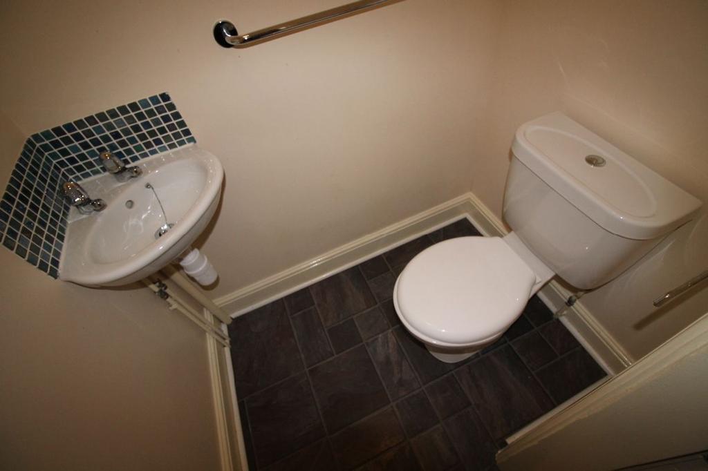 A well-maintained single toilet featuring moder...