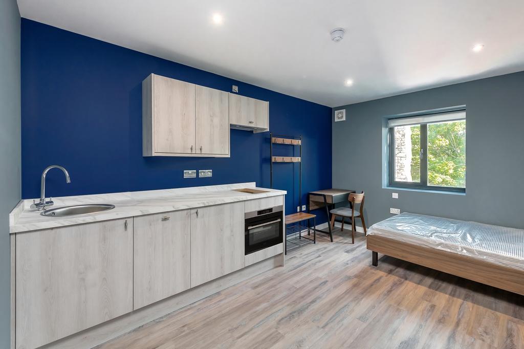 A modern and inviting double bedroom with a wel...