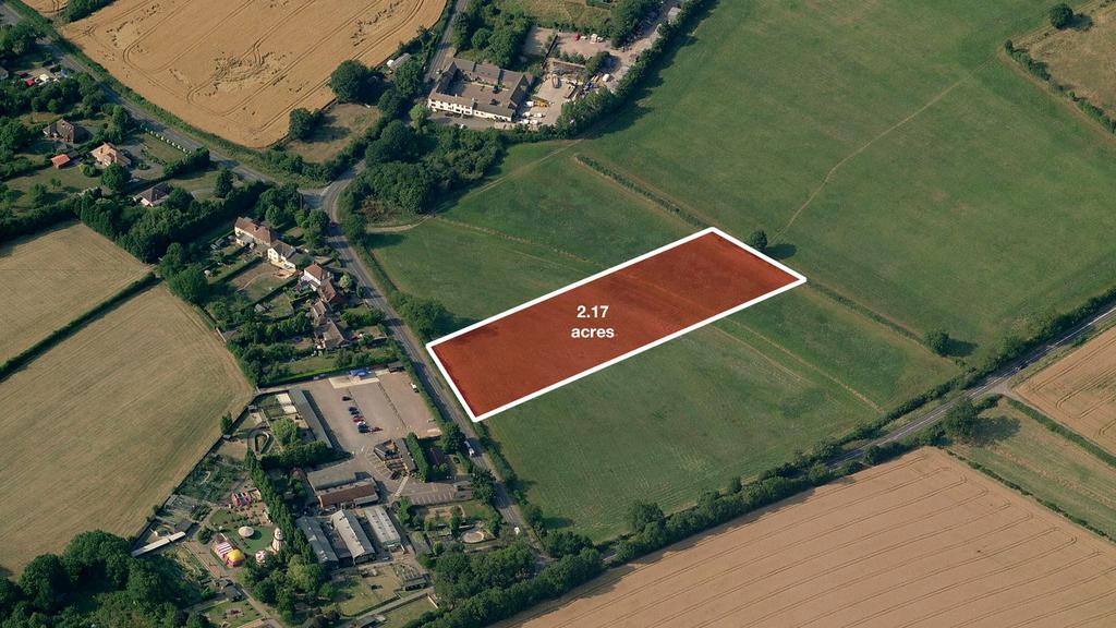 Land for sale on a residential road.