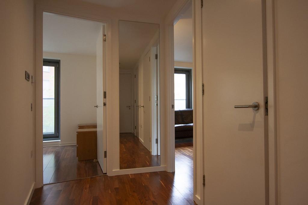 HALLWAY with LAMINATED FLOORING to RECEPTION...