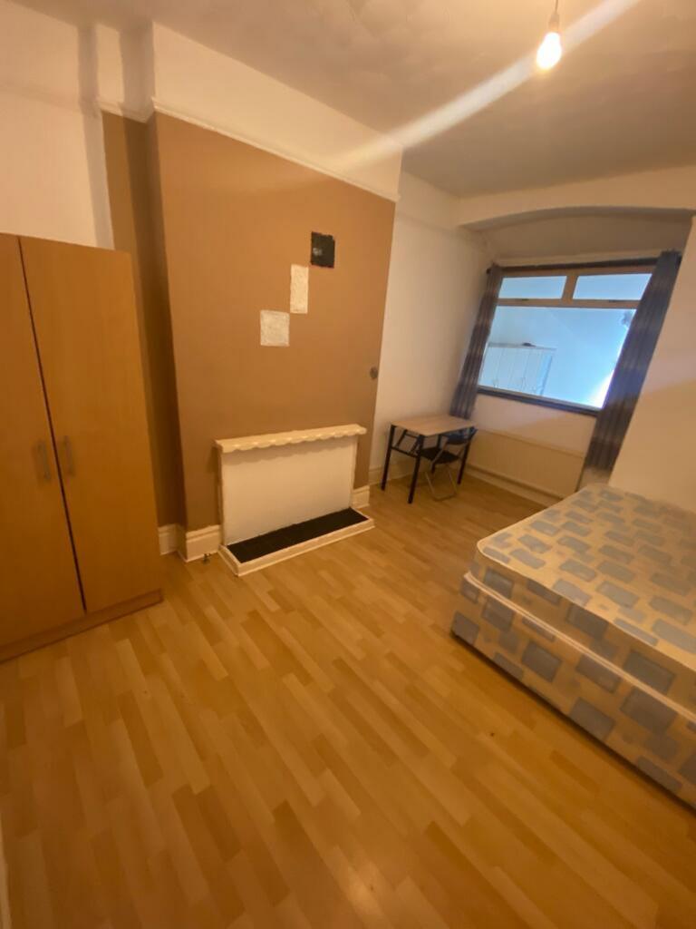 Spacious double bedroom featuring a comfortable...