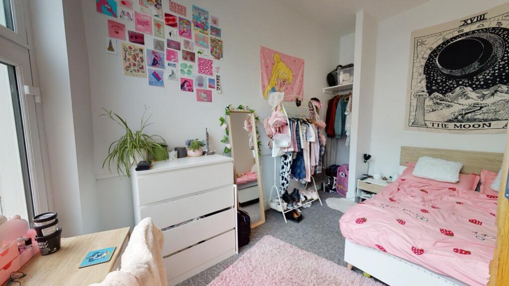 Charming double bedroom featuring ample natural...