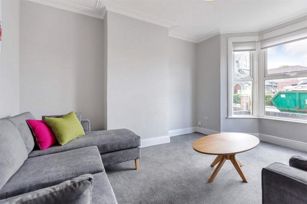 This stylish living room features a comfortable...