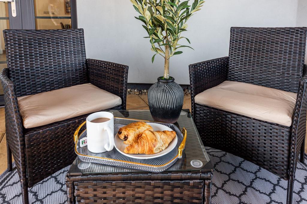 Cozy outdoor seating area featuring two cushion...