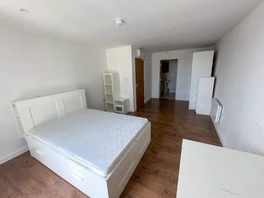 Bright and spacious master bedroom featuring a ...