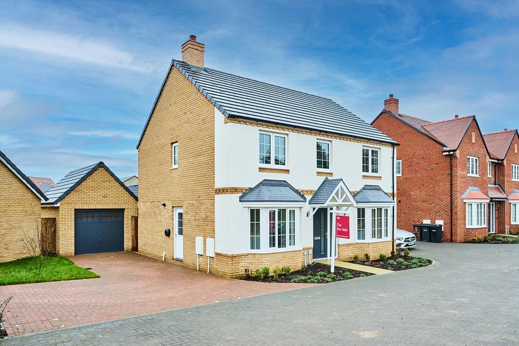 A stylish rendered home with garage and...