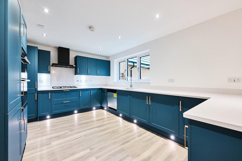 This home comes with a fitted blue kitchen