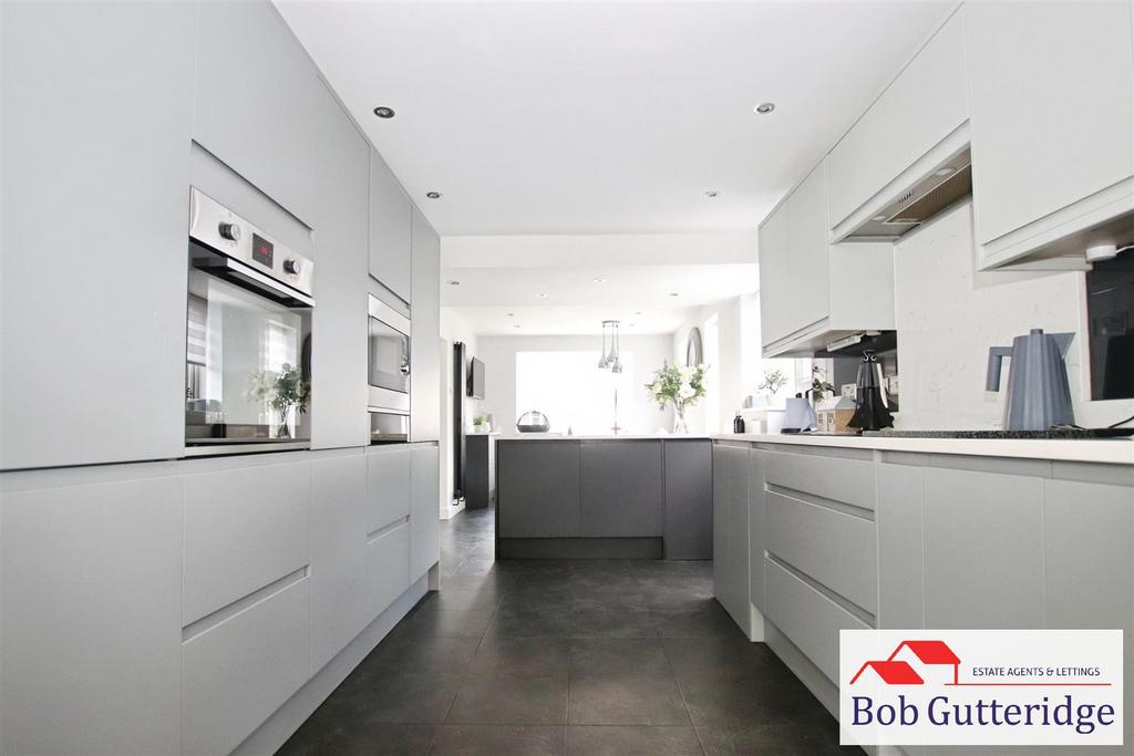 Open plan fitted kitchen / dining room