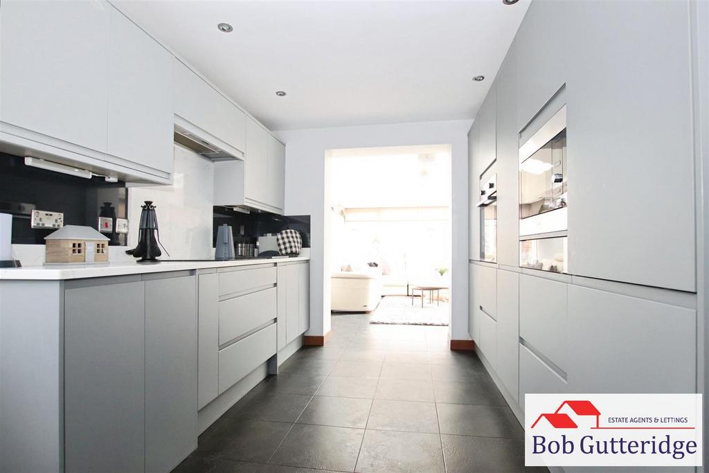 Open plan fitted kitchen / dining room
