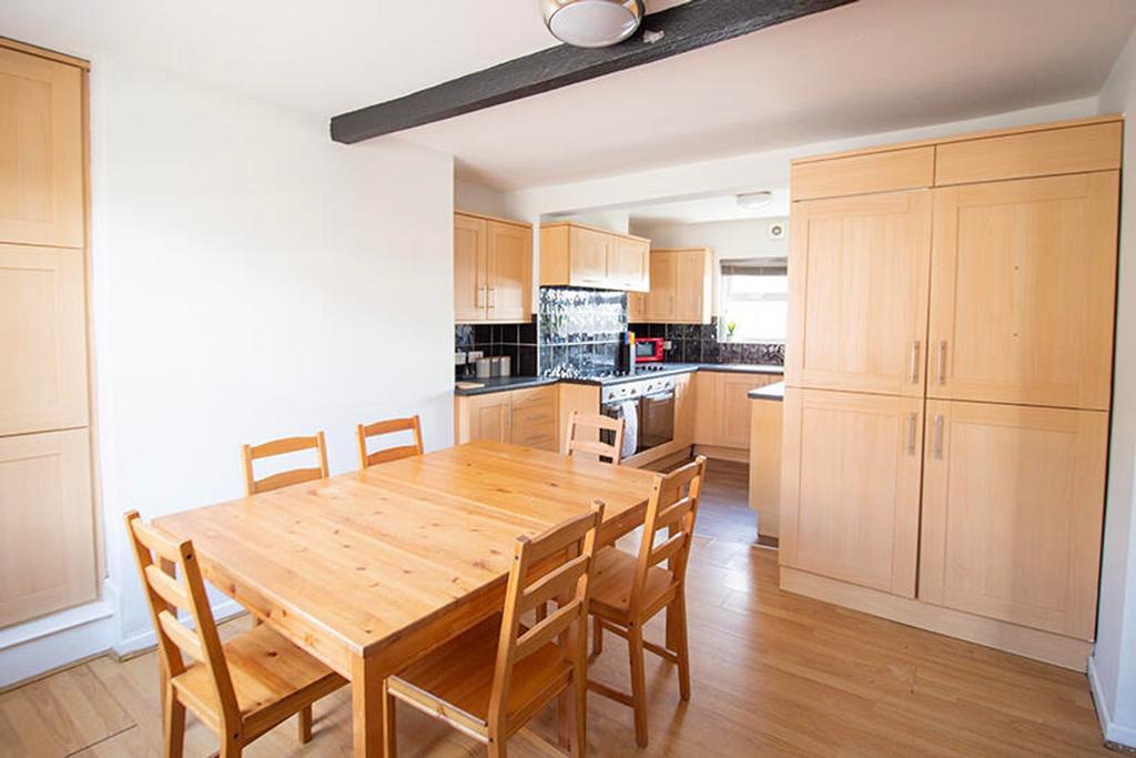 A bright and spacious kitchen featuring modern ...