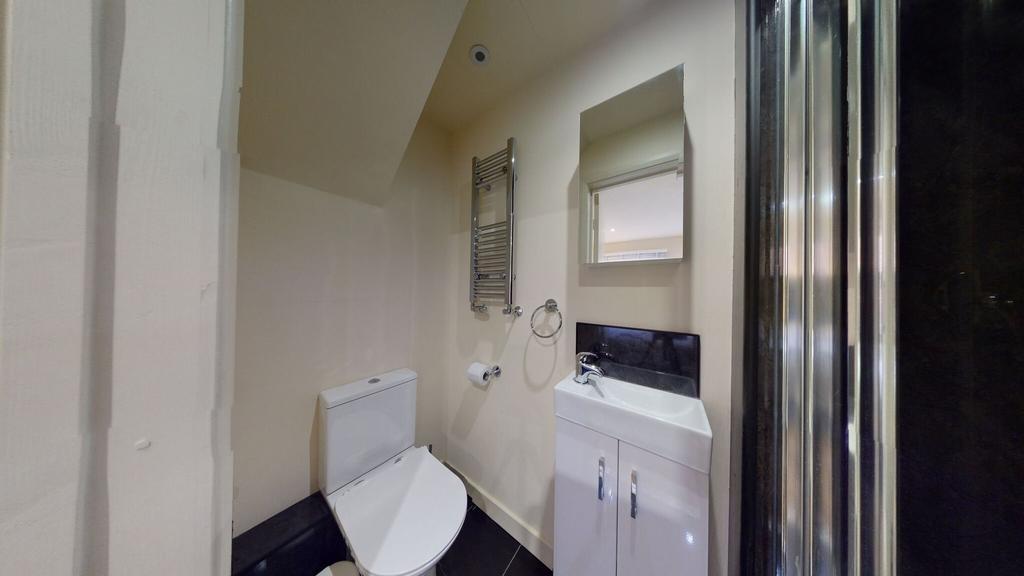 A modern and well-maintained single toilet feat...