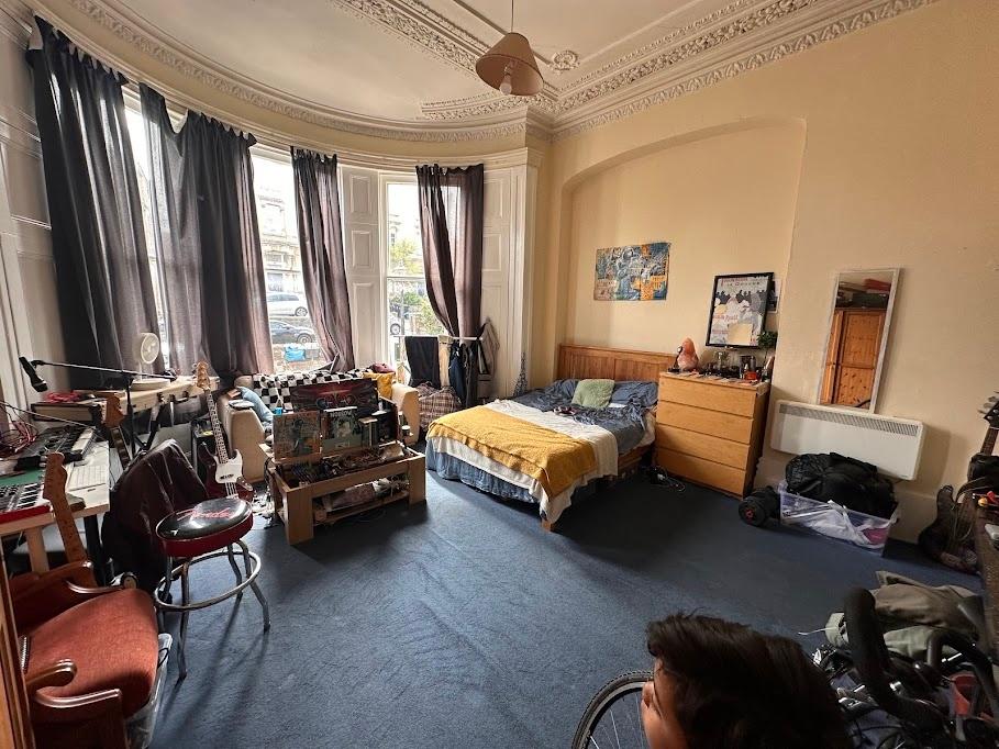 Spacious and charming master bedroom featuring ...