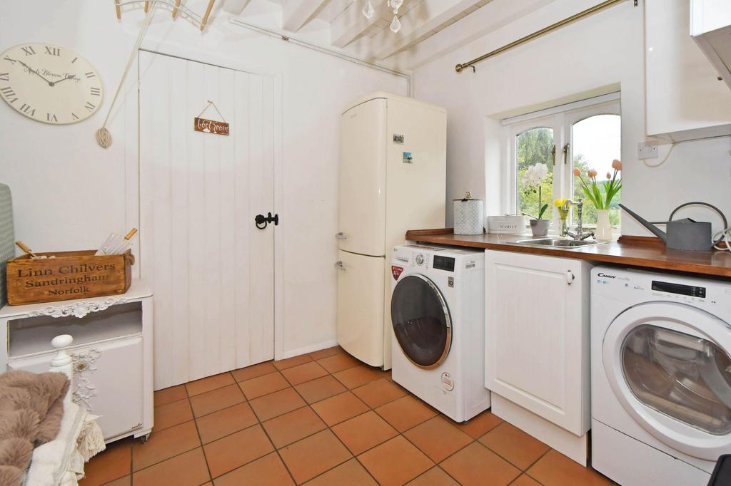 Utility room leading to WC