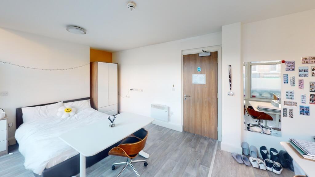 Bright and spacious master bedroom featuring a ...