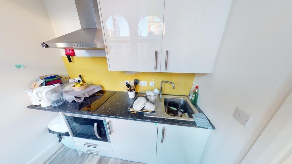 A bright and functional kitchen area featuring ...
