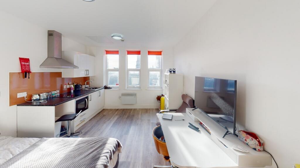 Bright and spacious double bedroom featuring a ...