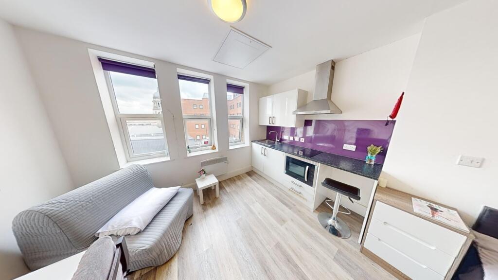 A bright and inviting living room with modern d...