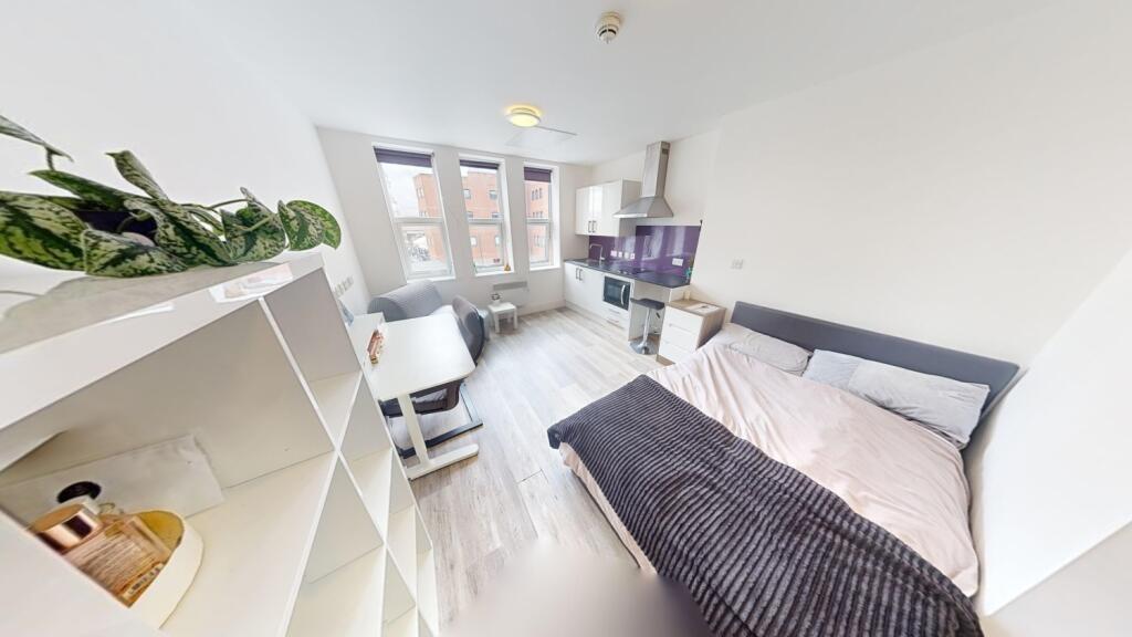 A bright and tidy double bedroom with a comfort...