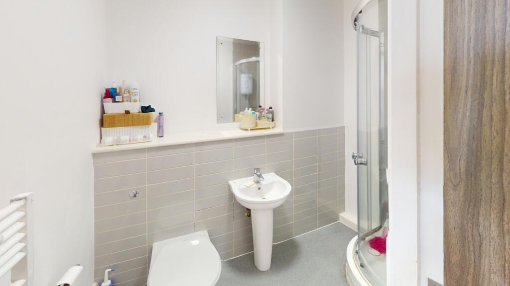 A clean and functional bathroom featuring a toi...