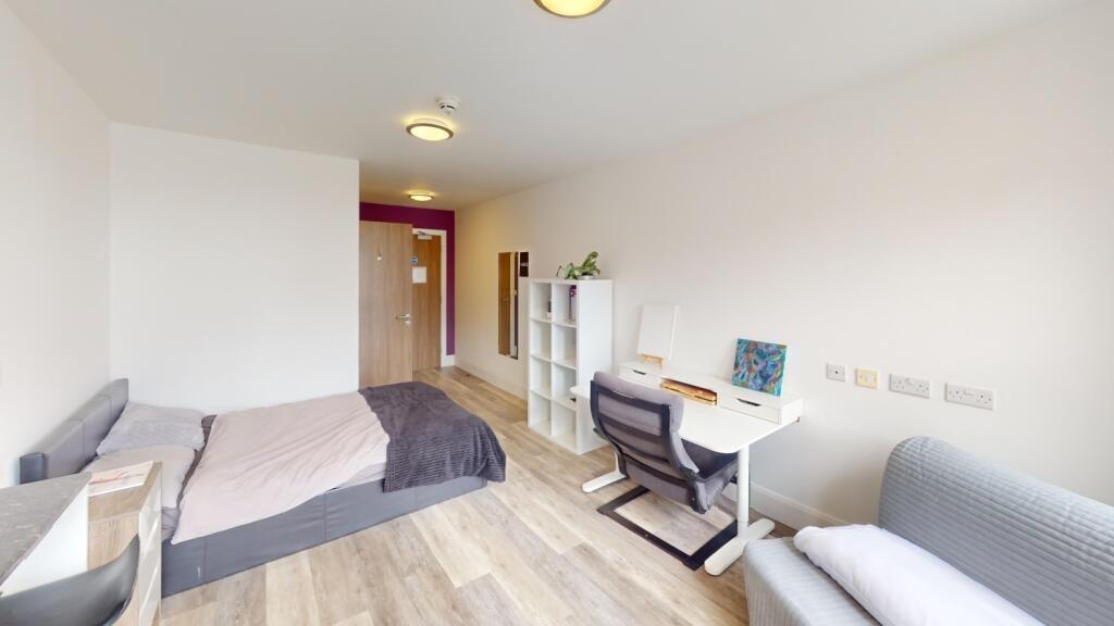 Bright and inviting bedroom featuring a comfort...