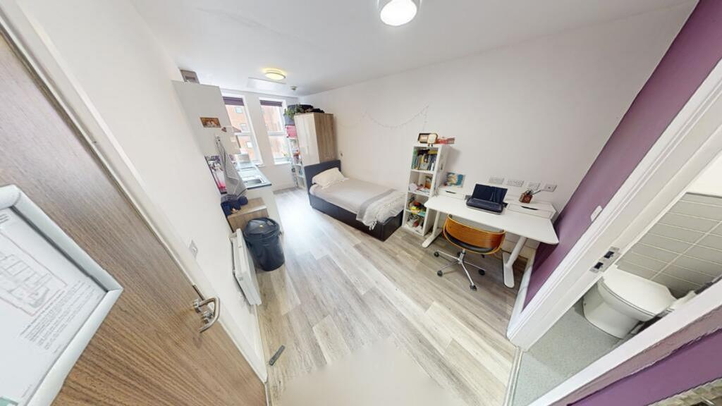 A bright and spacious double bedroom featuring ...