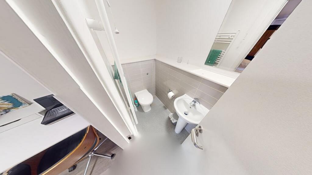 A modern bathroom featuring clean lines and a m...