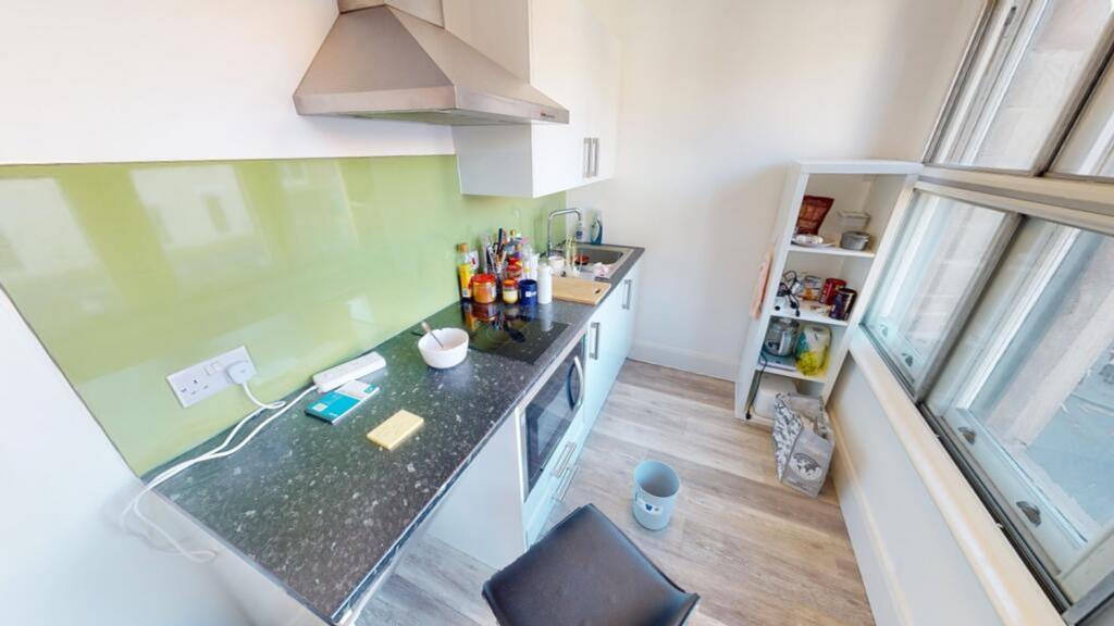 A modern kitchen featuring a sleek design with ...