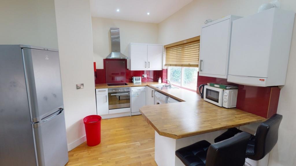 A bright and tidy kitchenette featuring modern ...
