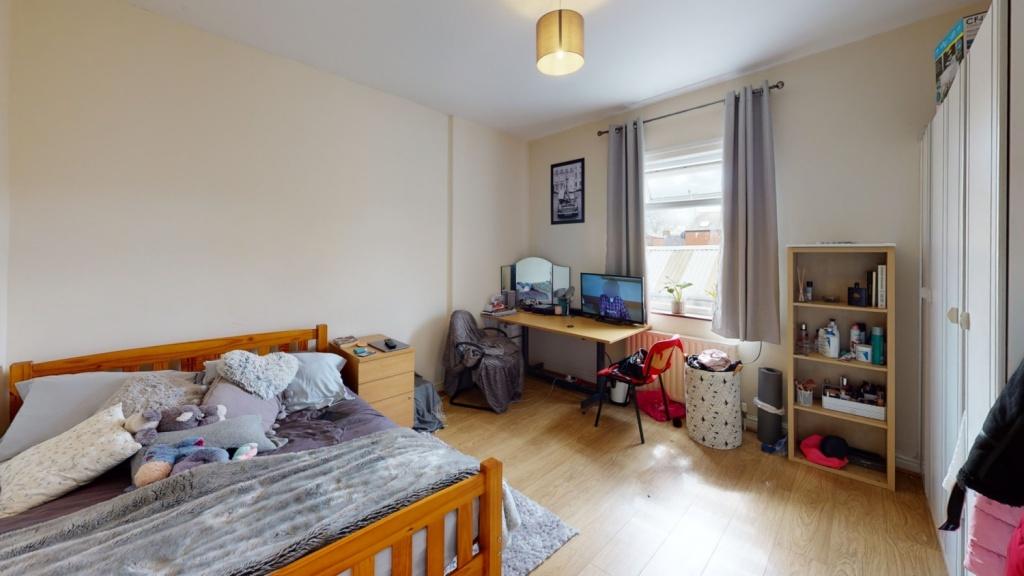 Bright and comfortable master bedroom featuring...