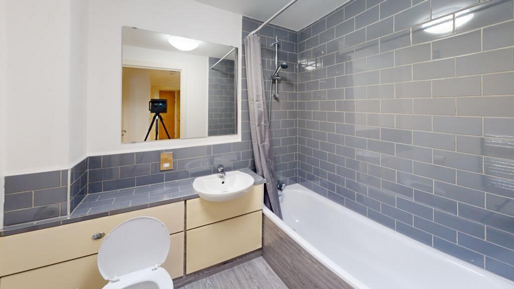 A modern and clean bathroom featuring stylish g...