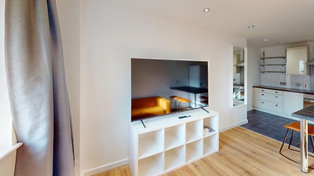 A bright and inviting living room featuring mod...