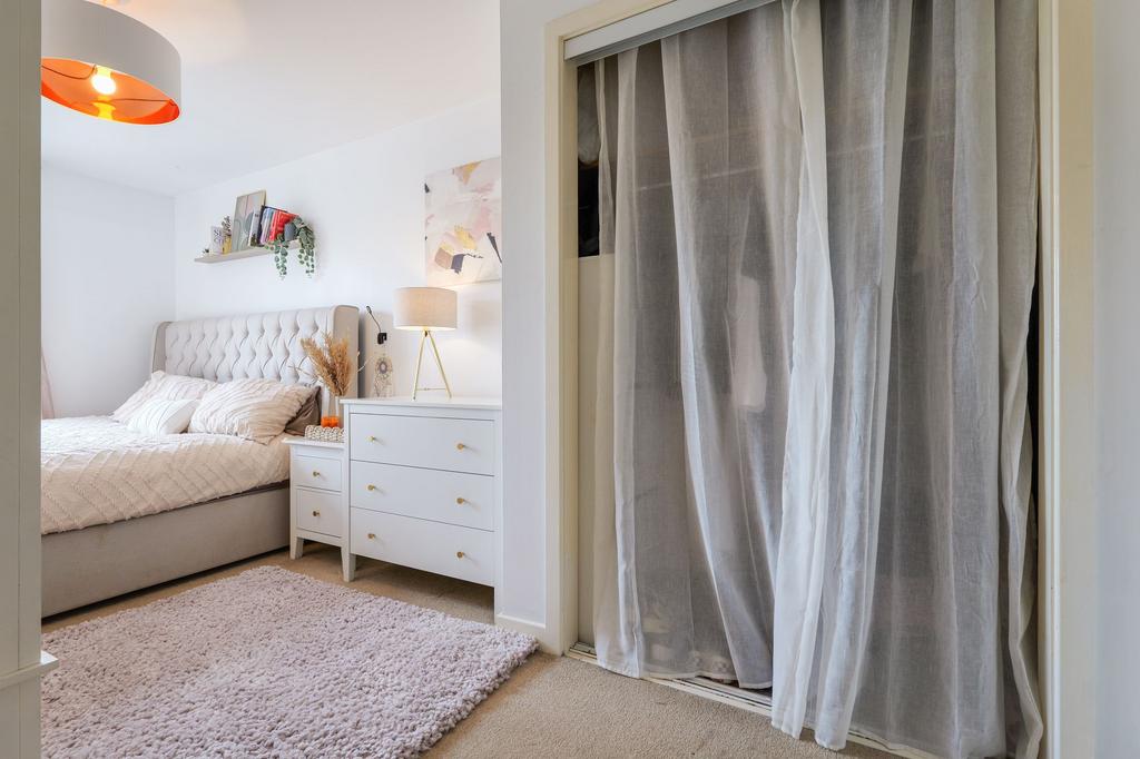 Deep wardrobe and view of super king sleeping area
