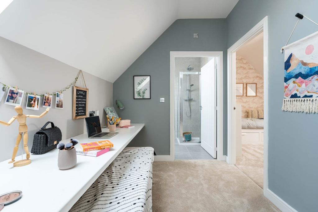 A desk and dressing table area maximise the...