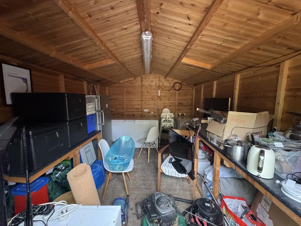 Timber Shed Adjoining House
