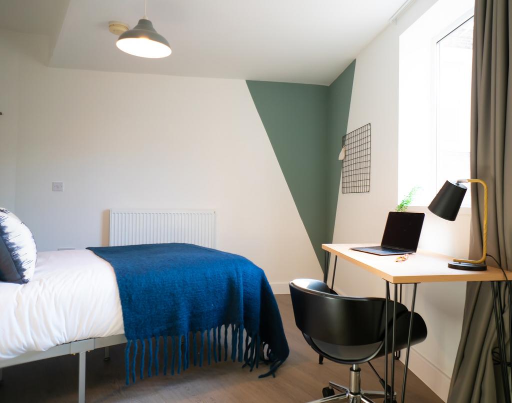 A bright and well-presented master bedroom feat...